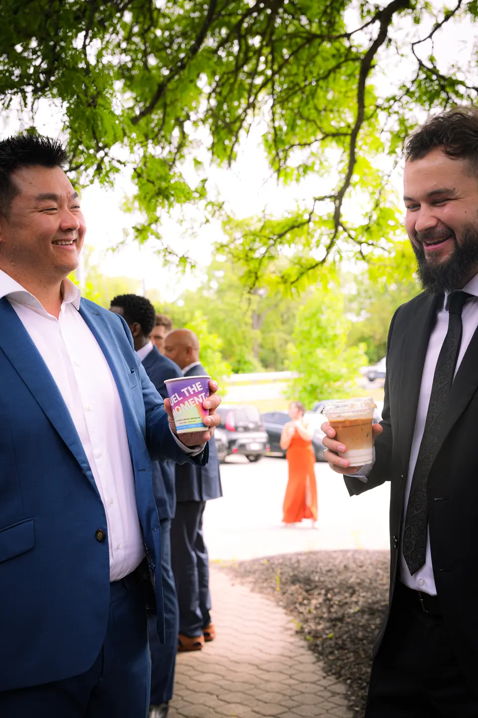 Wedding guests talking together outside the venue