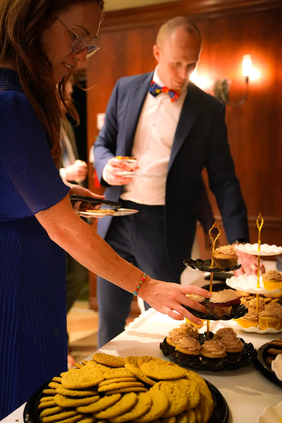 The couple serving dessert together